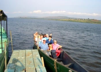 Volunteers Board Boat at Source of the Nile
